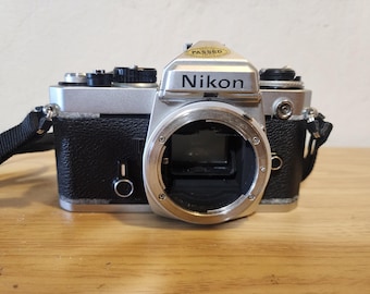 Nikon FE 35mm SLR Film Camera Body – Powers On, Needs Repair