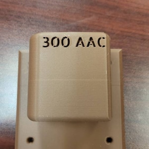 3D printed AR rifle wall mount.