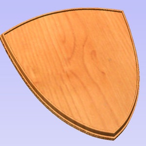 May include: A shield-shaped wooden plaque. The plaque is light brown with visible wood grain. The edges are a darker shade, forming a border. The background is a light blue.