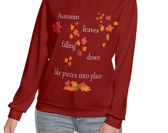 Puede incluir: Una sudadera granate con el texto "Autumn leaves falling down like pieces into place". El diseño presenta hojas de otoño cayendo en tonos naranja, rojo y amarillo. La parte superior de manga larga es de estilo casual y cómodo.