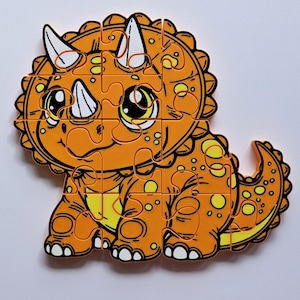 May include: Orange and yellow dinosaur puzzle with large eyes and a frill. The puzzle is made of foam and has 16 pieces.
