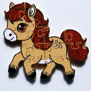 May include: A tan and white horse puzzle with a brown mane and tail. The puzzle is made of plastic and has a cartoon-like style.