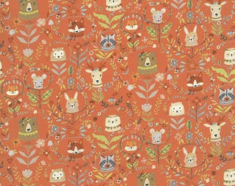 May include: A repeating pattern of woodland creatures, including bears, foxes, owls, deer, and rabbits, on a burnt orange background. The design features the animals within floral wreaths and decorative foliage.