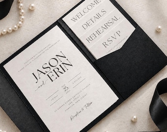 May include: A black wedding invitation folder containing a cream-colored main card with the text JASON and ERIN, Friday Aug 25 2023, and four smaller insert cards labeled WELCOME, DETAILS, REHEARSAL, and RSVP, accented by black ribbon and pearls.
