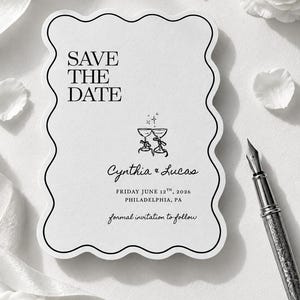 May include: A white scalloped-edge Save the Date card featuring black text that reads SAVE THE DATE, Cynthia & Lucas, FRIDAY JUNE 12TH, 2026, PHILADELPHIA, PA, and formal invitation to follow, with a graphic of two clinking champagne glasses.