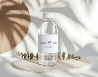 May include: A clear plastic water bottle with a white label that says "Jason & Erin 08.25.23 Hampton, NJ".