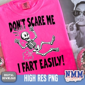 May include: Bright pink t-shirt with the text "DON'T SCARE ME I FART EASILY!" and a cartoon skeleton graphic. The shirt also has the words "HIGH RES PNG" and "DIGITAL DOWNLOAD" on it.