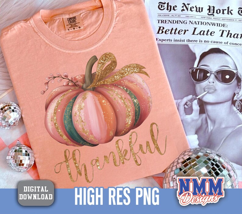 May include: A peach-coloured t-shirt with a watercolour pumpkin design in pink, green, and gold. The word "thankful" is written in gold script below the pumpkin. The shirt is a digital download, high-resolution PNG.