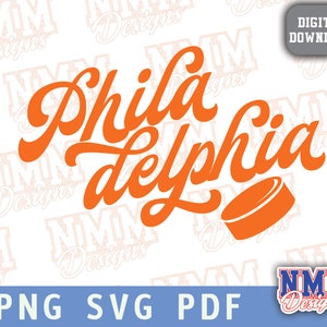 May include: Orange and white graphic design with the text "Philadelphia" in a stylized font. The graphic includes a hockey puck.