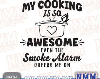 May include: Black and white graphic design with the text "My cooking is so awesome even the smoke alarm cheers me on". The graphic includes a pot with a heart and a flame.