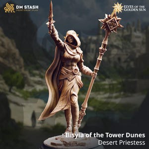 May include: A detailed figurine of Ilisyia of the Tower Dunes, a Desert Priestess, holding a staff and a blade. The figure is in a dynamic pose, wearing a hooded cloak and armor. The base is round. The text "DM STASH" and "ELVES OF THE GOLDEN SUN" are visible.