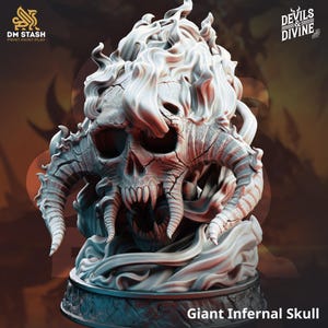 May include: A detailed, gray-toned sculpture of a Giant Infernal Skull. The skull features large horns, sharp teeth, and a fiery, cloud-like element above. The base is textured, and the image includes the text "DM STASH PRINT.PAINT.PLAY" and "DEVILS & DIVINE".