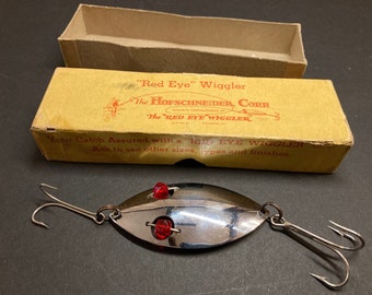 Rare vintage fishing lure original boxed Hofschneider red eye wiggler. Old collectable tackle spoon bait