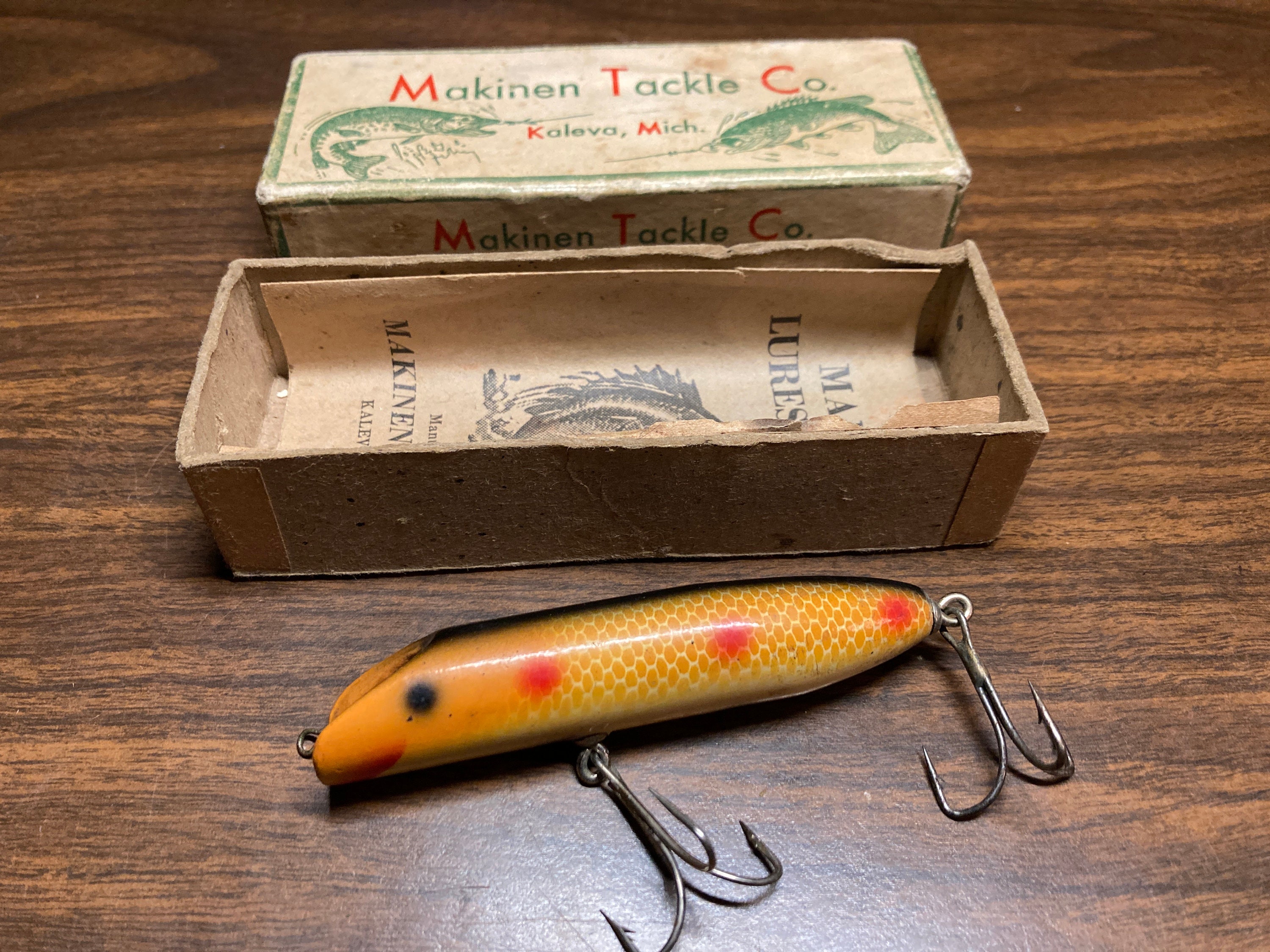 Collectable vintage wooden fishing lure with box and early edition original  paper. Rare color pattern by Makinen Tackle Co Kaleva, MI