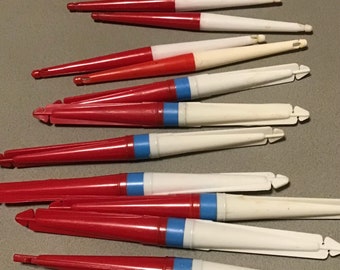 Nice vintage lot of collectible fishing bobbers. 12 old red and white pencil floats in mint condition for age. Great tackle display or gift