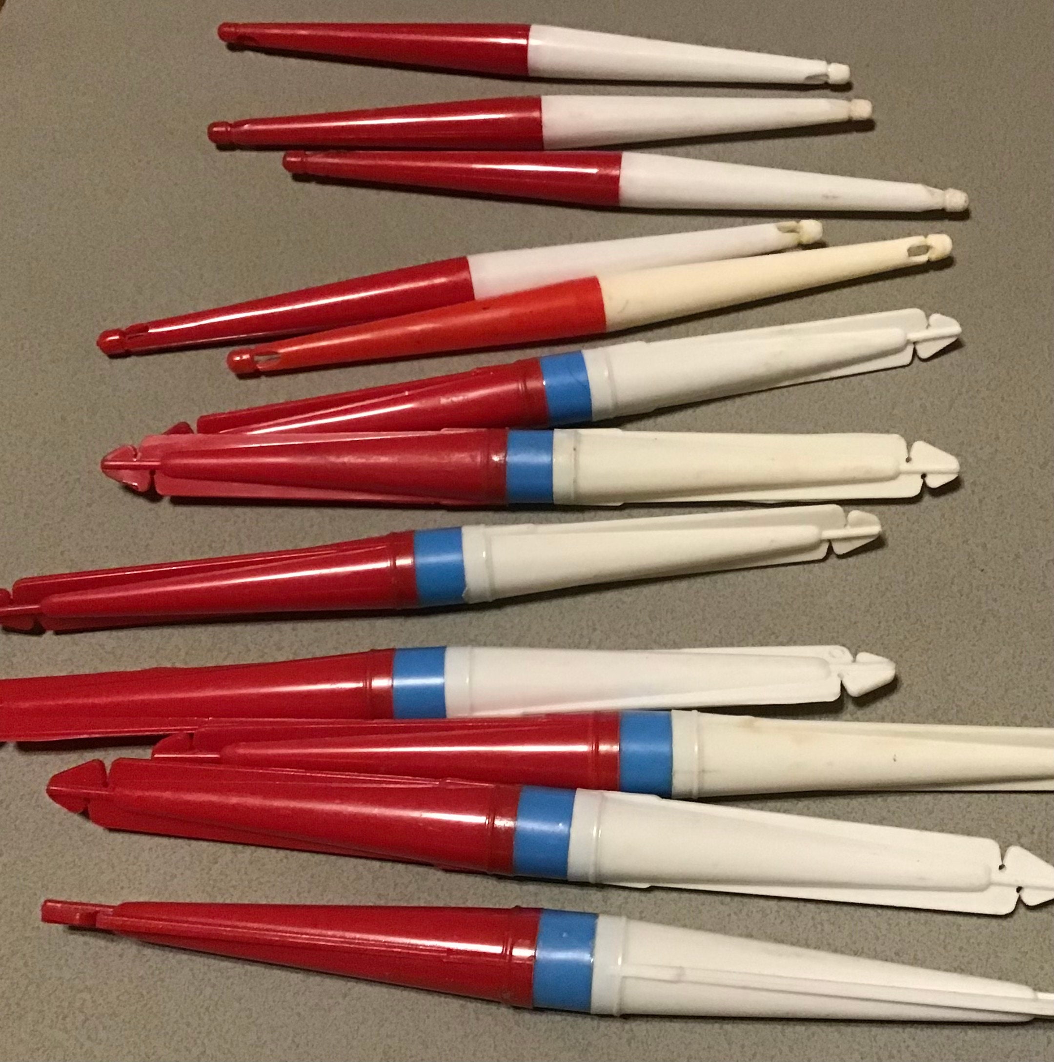 Nice vintage lot of collectible fishing bobbers. 12 old red and white  pencil floats in mint condition for age. Great tackle display or gift