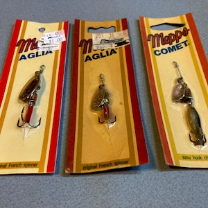 Old fishing tackle. Vintage Mepps spinners in original sealed packs. These French spinner baits are set for display or collection