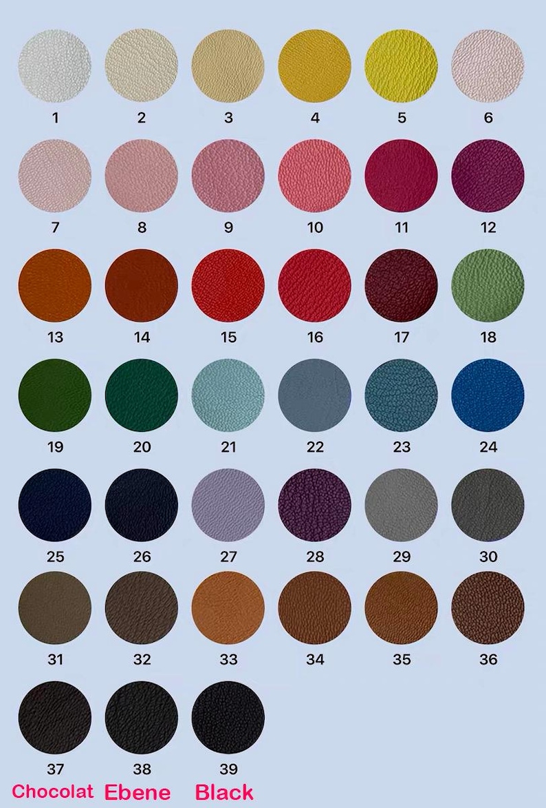 May include: A color chart featuring 39 circular swatches in various shades. Colors range from light beige to black, with options like pink, red, green, blue, and brown. The chart includes the text "Chocolat Ebene Black" at the bottom.