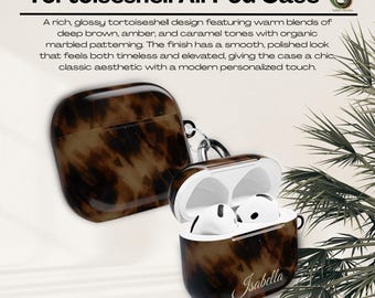 Könnte beinhalten: AirPod-Hülle im Schildpatt-Design mit glänzendem Finish. Die Hülle hat ein marmoriertes Muster in Braun-, Bernstein- und Karamelltönen. Der Name "Isabella" steht auf der Hülle. Der Text "Tortoiseshell AirPod Case" steht oben.