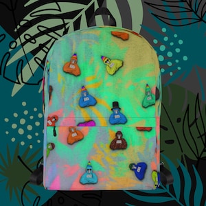 May include: A colourful tie-dye backpack with a repeating pattern of cartoon monkeys wearing hats. The monkeys are in various colours, including blue, red, yellow, and green. The backpack has a black zipper and adjustable straps.