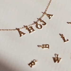 10k Gold Shiny Letter Pendant: Au417 Mini Cute Dangling Pendant- Collarbone Necklace, Bracelet, and Necklace Accent