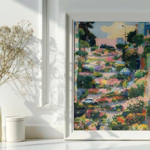May include: A painting of a winding road lined with colorful flowers and houses. The road is surrounded by lush greenery and the sky is a bright blue with white clouds.