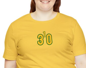 May include: A yellow t-shirt with a green and yellow graphic that says "3'0".