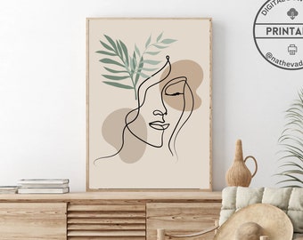 Può includere: Un'immagine di arte da parete stampabile digitale che presenta un disegno a linea di un viso femminile con una foglia di palma dietro di lei. Lo sfondo è di colore beige chiaro con forme astratte marroni.