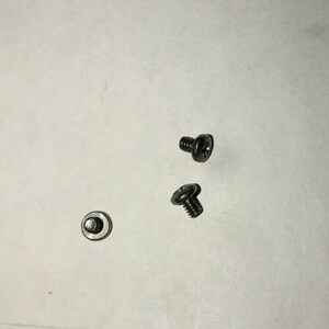 May include: Three silver screws and a silver washer.