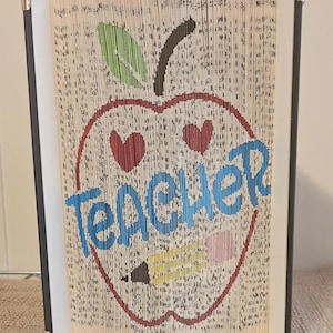 bookfolding pattern cut and fold teacher in a apple