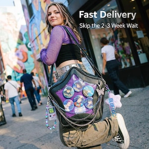 May include: Black star-shaped shoulder bag with a clear purple window displaying anime character buttons. The bag has silver chain accents, a butterfly charm, and a beaded game console keychain. The text "Fast Delivery" is visible.