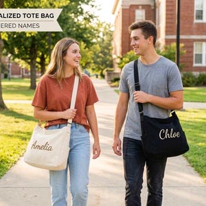 May include: Two people walking outdoors, each carrying a personalized tote bag. One bag is black with "Chloe" embroidered, the other is beige with "Amelia" embroidered. The text "PERSONALIZED TOTE BAG EMBROIDERED NAMES" is in the upper left.