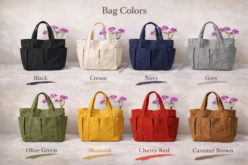 Puede incluir: Una colecci&oacute;n de bolsos tote en varios colores, incluyendo negro, crema, azul marino, gris, verde oliva, mostaza, rojo cereza y marr&oacute;n caramelo. Cada bolso tiene m&uacute;ltiples bolsillos y se muestra con flores moradas. El texto "Bag Colors" est&aacute; arriba.