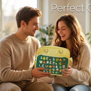 May include: A yellow satchel with a green panel featuring various cartoon characters is held by a person. The satchel has a handle and two small buckles. The text "Perfect Gift" is displayed above the satchel.