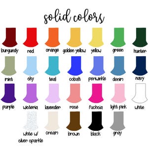 May include: A color chart titled solid colors displaying twenty-eight swatches in various hues including burgundy, red, orange, golden yellow, yellow, green, hunter, mint, sky, teal, cobalt, periwinkle, denim, navy, purple, wisteria, lavender, rose, fuchsia, light pink, white, white w/ silver sparkle, cream, brown, black, and gray.