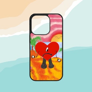 Pode incluir: Uma capa de telefone preta com um design colorido que apresenta um cora&ccedil;&atilde;o vermelho com uma cara triste, palmeiras e um p&ocirc;r do sol. O cora&ccedil;&atilde;o est&aacute; vestindo cal&ccedil;as pretas e tem bra&ccedil;os e pernas.