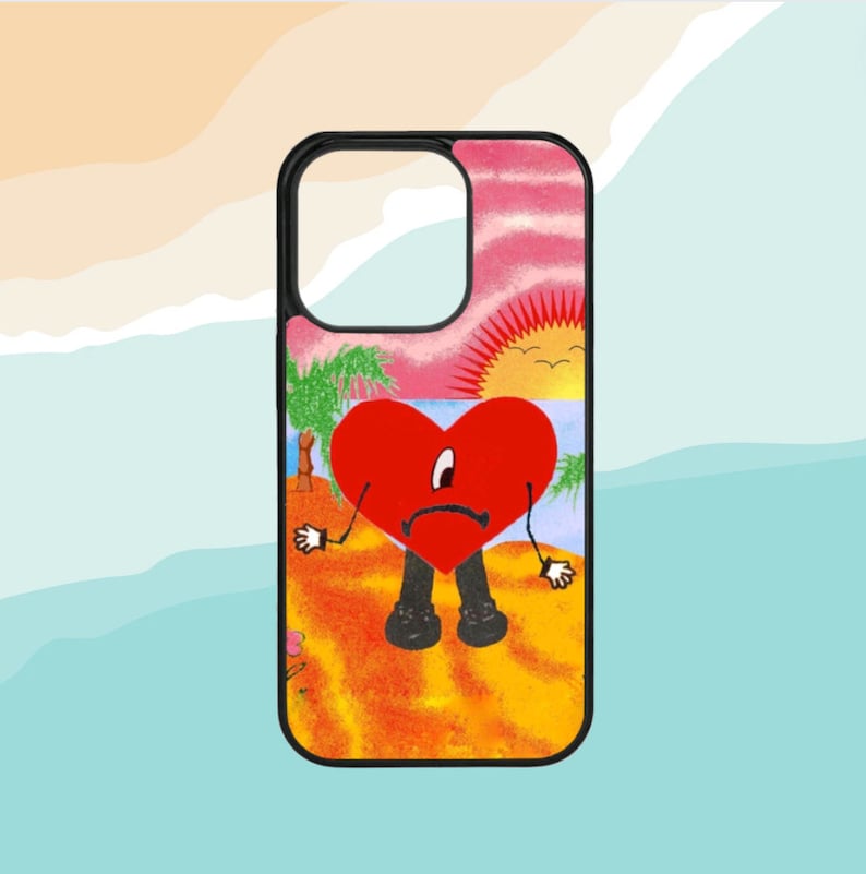 Pode incluir: Uma capa de telefone preta com um design colorido que apresenta um cora&ccedil;&atilde;o vermelho com uma cara triste, palmeiras e um p&ocirc;r do sol. O cora&ccedil;&atilde;o est&aacute; vestindo cal&ccedil;as pretas e tem bra&ccedil;os e pernas.