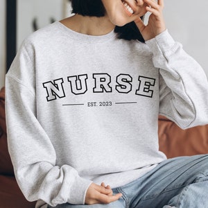 Nurse 2023 Sweatshirt, Sweatshirt for Nurse, Student Nurse Gift, Student Nurse Sweatshirt, Nurse Gift, Graduation Nurse Sweatshirt, RN Gift