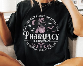May include: Black t-shirt with a graphic of a witch holding a cauldron and the text "The Modern-Day Apothecary Pharmacy Technician Potions Pills Elixirs".