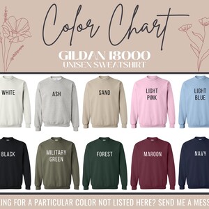 May include: Colour chart for Gildan 18000 unisex sweatshirts. The chart shows 12 different colours: white, ash, sand, light pink, light blue, black, military green, forest, maroon, navy, and more.