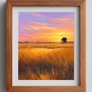 May include: A framed landscape art print depicting a vibrant sunset over a field of tall, golden grass. The sky transitions from purple to orange and yellow, with a lone tree in the distance. The frame is made of light brown wood.