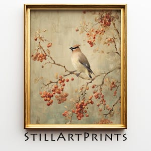 May include: A framed vintage-style print featuring a bird perched on a branch with red berries. The artwork has a muted color palette with a gold frame and the text "STILLARTPRINTS" at the bottom.