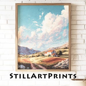 May include: A framed landscape art print featuring a rural scene with a farmhouse, fields, and mountains under a blue sky with fluffy clouds. The print is in a wooden frame. The text "STILLARTPRINTS" is at the bottom.