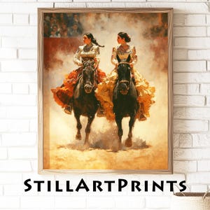 May include: A framed print depicting two women riding black horses in a bullfighting arena. They are dressed in elaborate costumes with orange and yellow skirts. The print has a warm, sepia tone. The text "STILLARTPRINTS" is displayed at the bottom of the image.