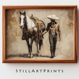 Peut inclure: Impression d'art encadrée d'un cheval et d'un homme en tenue traditionnelle. Le cheval est noir et blanc, sellé. L'homme porte un sombrero, une veste et un pantalon. L'impression est dans un cadre en bois. Le texte "STILLARTPRINTS" est en bas.