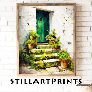May include: A framed art print of a detailed painting depicting a green door, stone steps, and potted plants. The artwork features a white stucco wall and a wooden frame. The text "STILLARTPRINTS" is at the bottom of the image.
