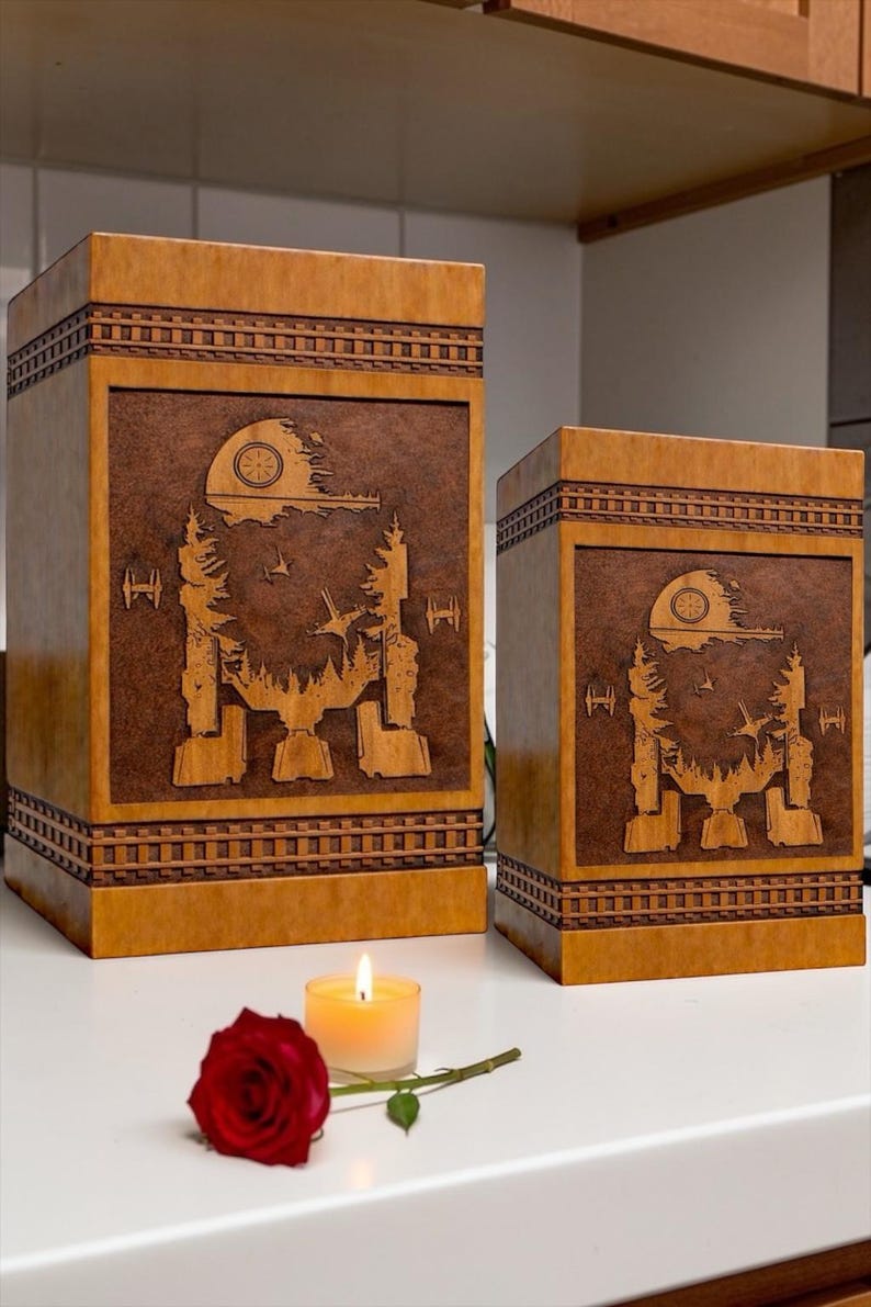 Decorative wooden urn box with detailed galactic walker and space themed laser engraving perfect for a sci-fi inspired memorial display.