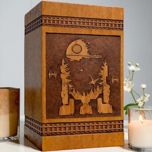 Unique sci-fi galaxy themed wooden urn box designed with walker machine and space ships engraving for memorial ashes storage.

Personalized wooden cremation urn with galactic walker memorial design engraved on premium wood keepsake urn box.