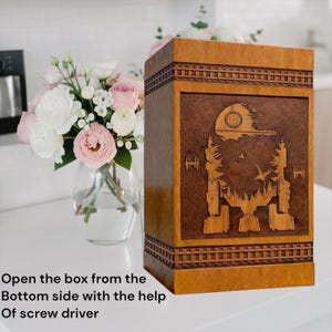 Handmade memorial urn with galaxy walker design featuring futuristic space scene engraved on a warm natural wood cremation urn box.