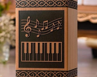 Urna musicale artigianale in palissandro con incisione di pianoforte e chiave di violino.